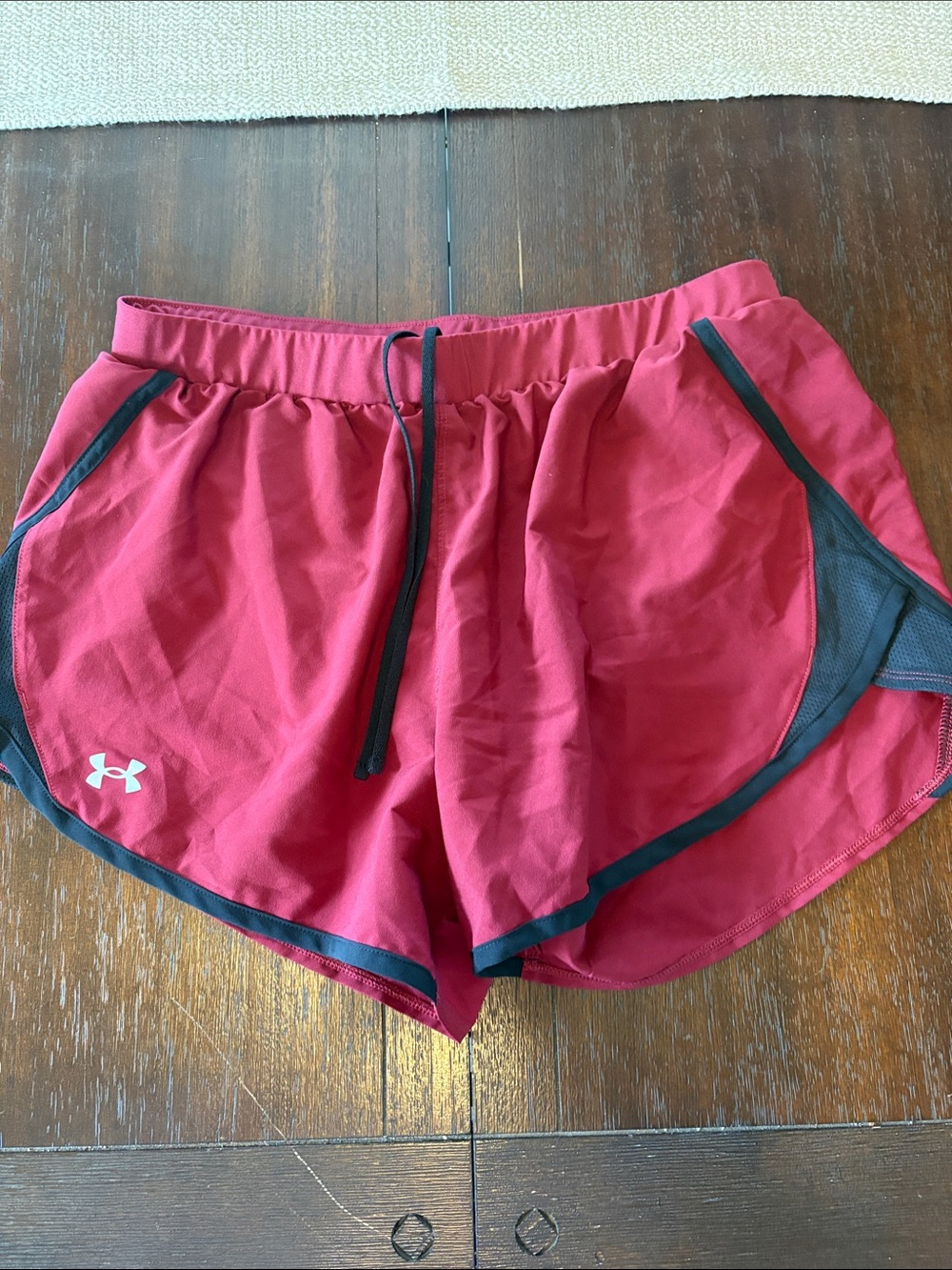 Under Armour Women's Red Athletic Shorts with Black Trim